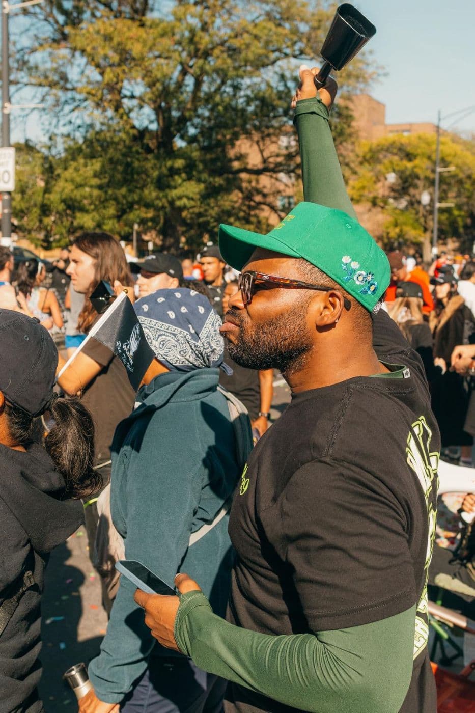 Cowbell in a green cap